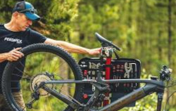 a person servicing a bike